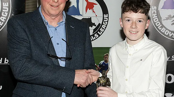 Declan Deasy presents the 2025 Boys U12 Player of the Year award to Sonny Cowley, Lyre Rovers. (Photo: Paddy Feen)