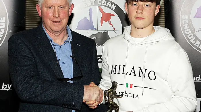 Declan Deasy presents the 2025 Academy U14 Player of the Year award to Max Bramoulle. (Photo: Paddy Feen)