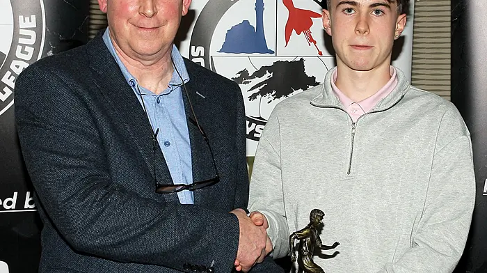 Declan Deasy presents the 2025 Academy U16 Player of the Year award to Oisin McCarthy. (Photo: Paddy Feen)