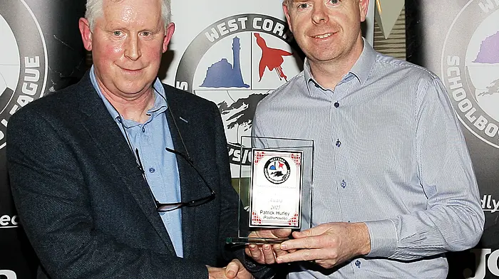 Declan Deasy presents a Special Recognition Award to Eamonn Hurley, brother of the late Patrick Hurley. (Photo: Paddy Feen)