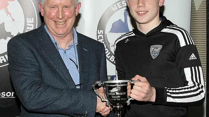 Declan Deasy, West Cork Schoolboys and Schoolgirls League Chairman, presents the 2025 Martin Briscoe WCSSL Player of the Year award to Jack Allen. (Photo: Paddy Feen)