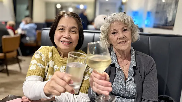 Maria Zita Benlayo and Nancy Brosnan raise a toast while celebrating International Women's Day in Schull, marking the occasion with friendship and good cheer. Photo by Carlos Benlayo