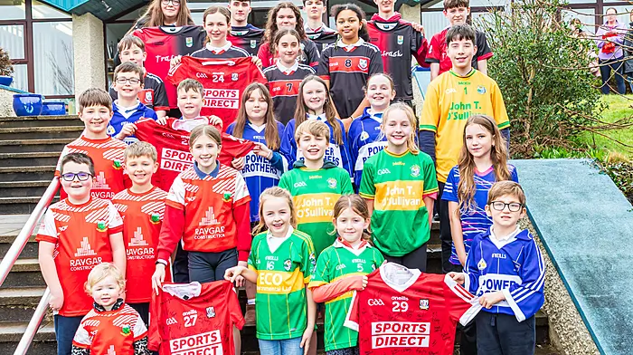 Children representing all the national schools in Beara come together to launch “Jersey Day” on 20th March, a fundraiser for Féile O Sullivan. The children all proudly wore their club jerseys.  Each school received a Cork Gaa Jersey from Ruairí Deane the jerseys are signed by the Senior Football team, these will be auctioned to raise funds to support Féile. Front row: Faye Downing, Farah O Sullivan, Chloe Harrington, Liam Harrington,2nd row: Jamie Dunne, Craig Downing, Croíadh Downing, Fiochra O Sullivan, Croídh O Sullivan,Kyla Harrington,3rd row: James Downing, Sean Óg Harrington, Nathan Harrington, Kiera Sullivan, Megan Harrington, Sophie Harrington, Jack O Sullivan4th Row: Don Power, Mia Kearney, Niamh Barry, Hanna O Sullivan5th Row: Ciara Blake, Ellie O Sullivan, Sean Óg Sullivan, Daniel Mason, Adam O Sullivan, Austin Harrington Picture: Anne Marie Cronin Photography