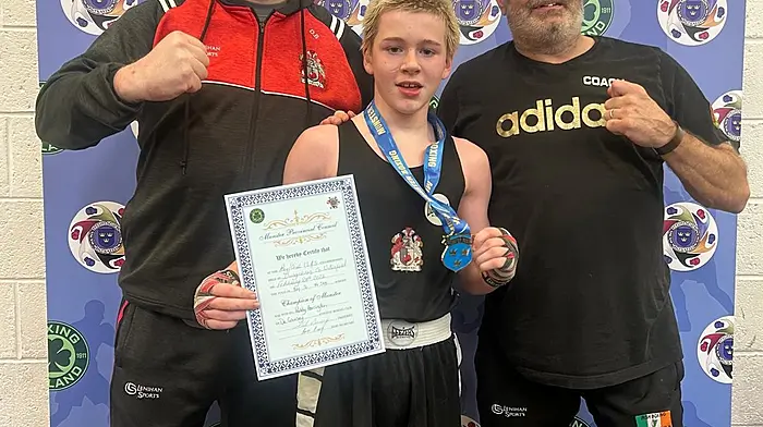 Paddy Harrington, Munster boxing champion at his age group, with his club coach Dave Burke (left) and head coach of The De Courcey Boxing Club, Will Rossall.