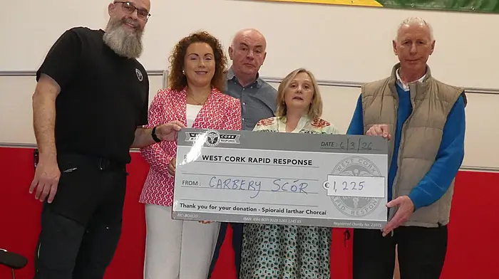 At the final of the Carbery Scór competitions last Friday night at Ballinascarthy Community Hall, West Cork Rapid Response was presented with a donation. From left: Dr Jason van der Velde, Kathleen O'Sullivan (MC), Liam Hodnett (chairman), Deirdre Hodnett (secretary) and Michael Kearns (treasurer).