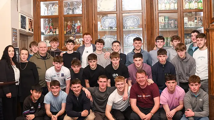 The jubilant Ibane Gaels U21 footballers at their medal presentation. Included in the photo with the players are team mentors Danny Murphy, Donal Ó Buachalla and John McSweeney. Fidelma and Brid, sisters of the late Donal Holland, are also included.