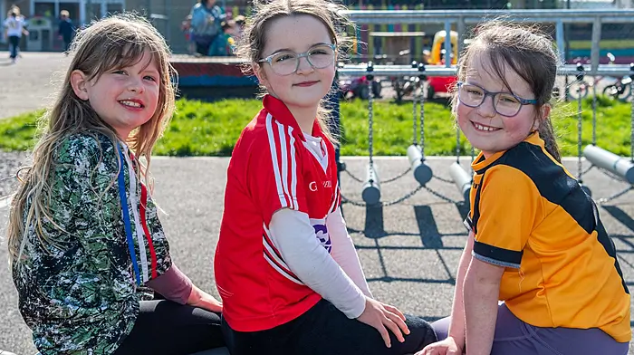 Enniskeane, West Cork, Ireland. 20th Mar, 2026. Primary and Secondary Schools around West Cork have swapped their school uniforms for sporting shirts today to raise money for Féile O'Sullivan of Allihies who lost both her legs in a farm accident last July. Emmie McCarthy- Jones; Danielle O'Sullivan and Ciara Hennessy of 1st class took part in the jersey day. Picture: Andy Gibson.