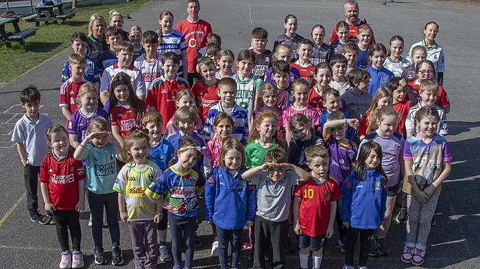 Pupils and staff from the Scoil Naomh Bhríde in Union Hall supporting the Stand for Féile jersey day, wearing their jerseys of choice for the day.  (Photo: Andrew Harris)
