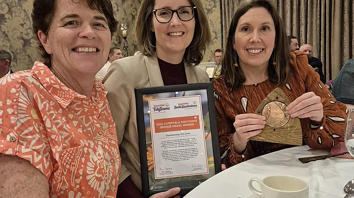 Karen Collins, Saskia McCarthy and Siobhán Higgins accepting the Tidy Towns bronze medal on behalf of Dunmanway Community Council.