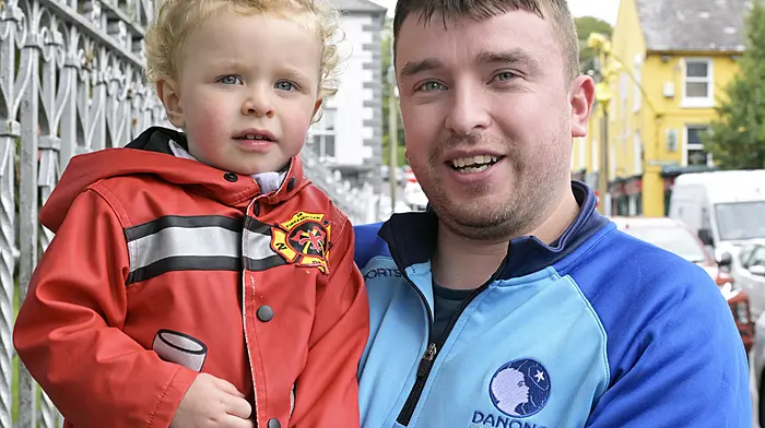 Clonakilty's Albie Griffin is his firefighter jacket with his dad Patrick out and about town. Photo: Martin Walsh.