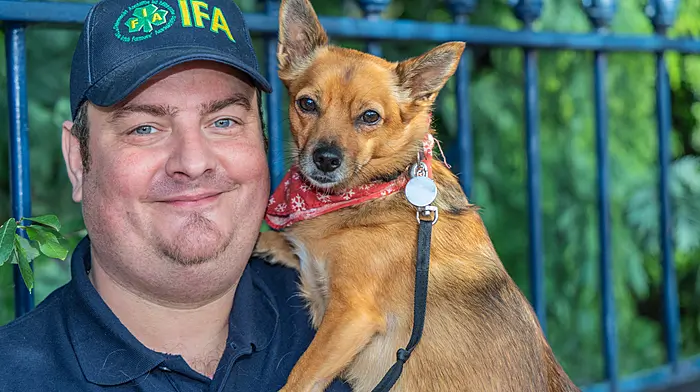 Artua Wlodarczyk and his dog, Zula, at the IFA commemoration event in Bantry which was held to mark the 60th anniversary of the NFA Farmers march to Dublin in 1966.  (Photo: Gearoid Holland)