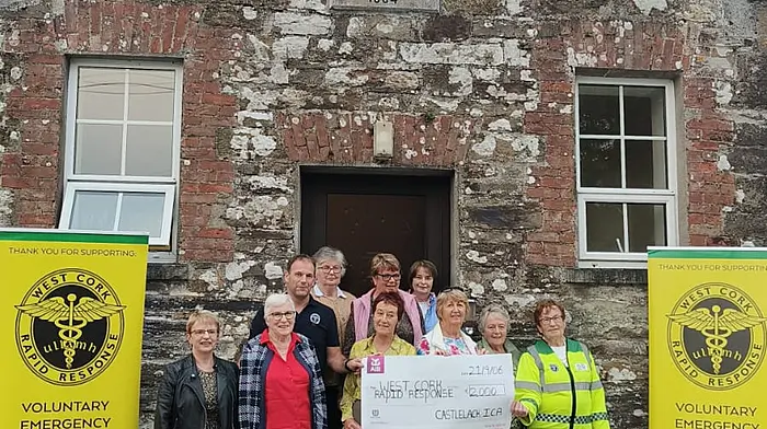 Betty Hennessey and Eamonn Barry receiving a cheque for €2,500 on behalf of West Cork Rapid Response from members of Castlelack ICA after their fundraising coffee morning.