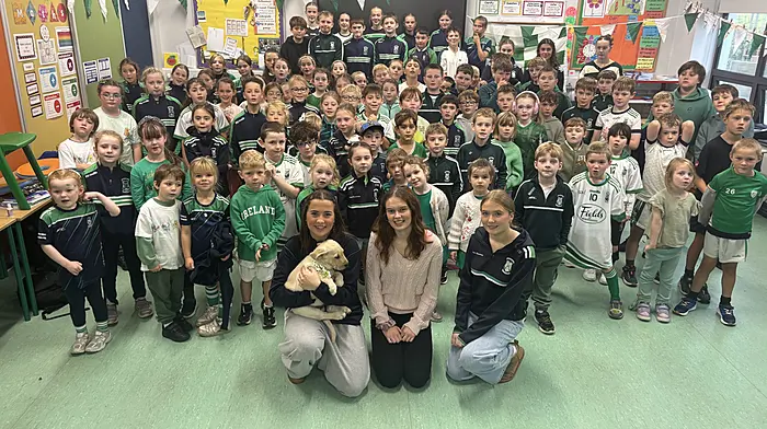 Pupils at Rath National School had great fun supporting the Ilen Rovers ladies before their county final, pictured here with players Daisy Griffiths and her puppy Hamish, Anna Collins who is teaching in the school at the moment, and Lucy O’Driscoll who was on Transition Year work experience.