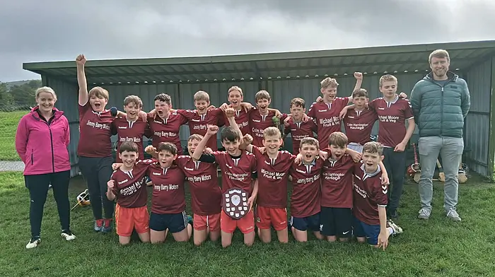 The Dromore National School boys’ hurling team that won the Sciath na Scol hurling shield final recently and (right) the girls who were unlucky in their Sciath na Scol camogie cup final. Included in the photos are Orla O'Sullivan (teacher) and Kevin Mulcahy (principal) who both helped the teams as coaches.