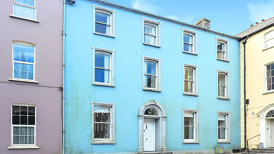 Nestled in the corner of Emmet Square, no 14 is crying out for a new owner to restore it to glory. Inset top: A bungalow in the property’s walled garden could be negotiated as part of the sale, adding to its immense appeal.