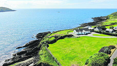 Coastal bungalow has pebble beach and secret garden Image
