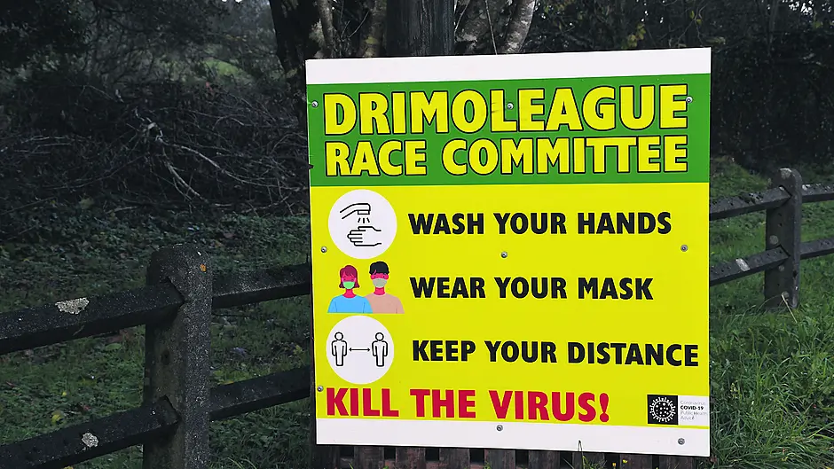 Race committee erects Covid information signs in village Image