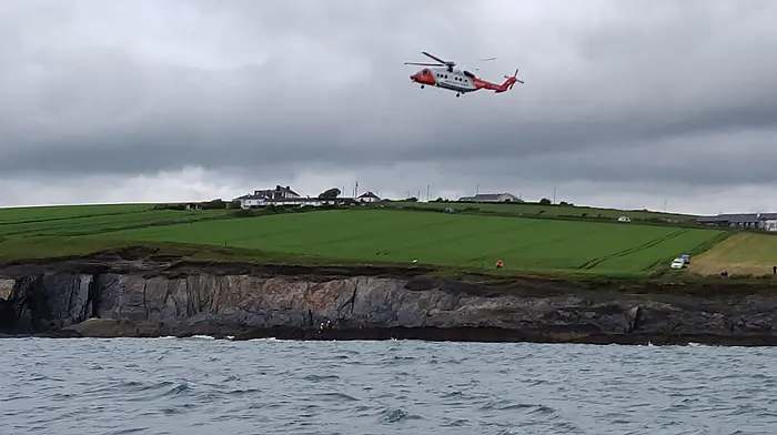Kinsale RNLI crew on training exercise spot man in difficulty in sea Image