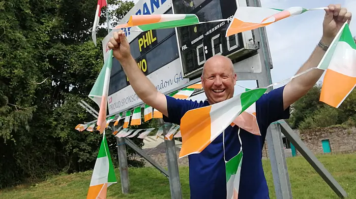 Ian Doyle erecting bunting at Bandon GAA Club. (Photo: Denis Boyle)