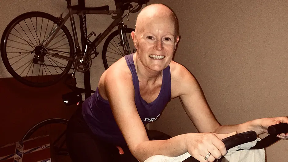 Ber Downey on her spinning bike at home, just six weeks into her treatment.