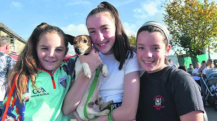 At the Caheragh threshing were Kayla McKennedy, Jodie and Ciara McCarthy with Snowy; (Photo: Anne Minihane)