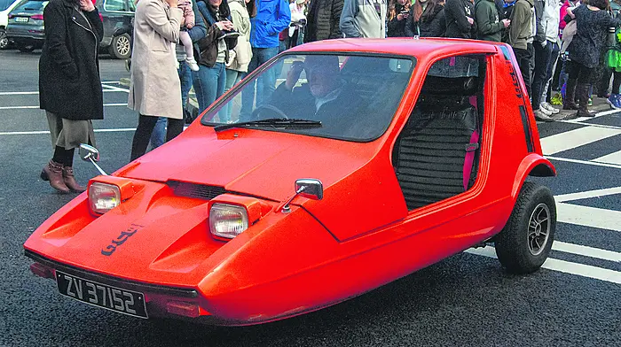 Ken snug in his beloved tangerine bug Image