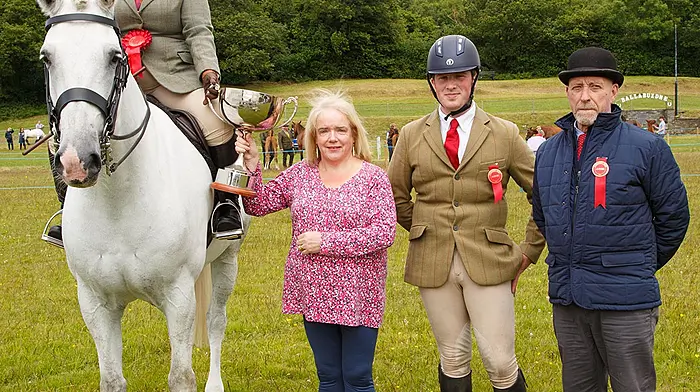 Sinead Barry, Rosscarbery ,winner in the Ridden Irish Draught class at Dunmanway show,  receiving the Mick Carroll Perpetual  Memorial Cup from Chrissie O'Mahony with judges Conor Wixted and Gary Guyatt. Photo: George Maguire