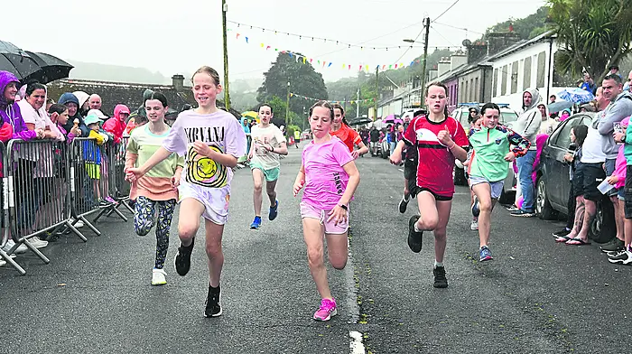Enjoying the street races during the regatta. 				    (Photo: Martin Walsh)