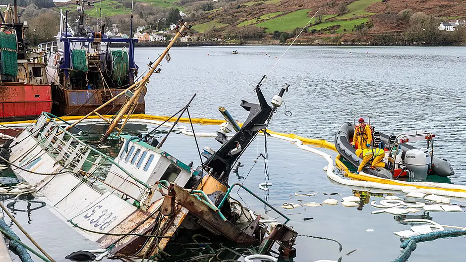 Sunken trawler under 24-hour watch to prevent fuel leakage Image