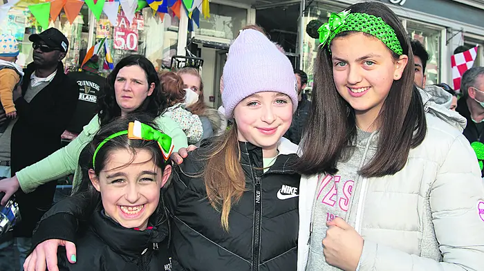 Having fun at the parade in Clonakilty were Michaele and Maeve Keohane, Ballygurteen and their friend Grace O’Donoghue, Clonakilty.  Right: Meabhdh Sexton, Lislevane and Ciarán Crowley, Clonakilty. (Photos: Martin Walsh)