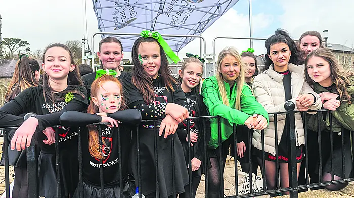 Michael and Claire Healy from Bantry Tidy Towns  in the parade. Left: dancers from Scoil Rince Carney after their performance in Bantry. Left: Rua, Doire and Niamh Murphy enjoying the fun in Castletownbere. (Photos: Andy Gibson & Anne Marie Cronin)