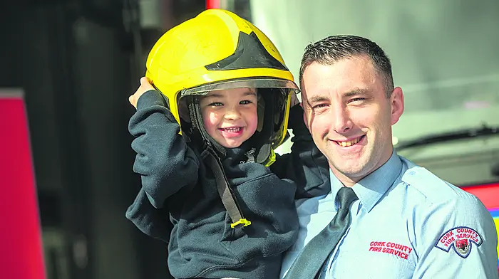 Aaron O’Leary and his firefighter dad David O’Leary were at the opening of Macroom’s new state-of-the-art fire station (Photos: John Allen)



Media Release
September 26th, 2022 
New State of the Art Macroom Fire Station Officially Opened
Macroom’s new state-of-the-art fire station has been officially opened by the Mayor of the County of Cork, Cllr Danny Collins and Minister for Housing, Local Government and Heritage, Darragh O’Brien TD.
The new fire station, located on Gurteenroe Road next to Macroom’s new Garda Station, will allow easy access to the new bypass to a service which responds to approximately 150 incidents per year including house fires, road traffic collisions, chimney fires as well as gorse, hill and grass fires. The new fire station will be staffed by a local crew of 10, in total, which includes a station officer, sub-station officer, driver mechanic and 7 firefighters. 
Designed by Cork County Council staff and constructed by Cahalane Brothers’ Construction, the new fire station is a state-of-the-art building, tied to the national network of fire service mobilisation and communications centres. 
Officially opening the new station, Mayor of the County of Cork, Cllr Danny Collins highlighted how, “This new, state of the art fire station, is a fantastic addition to Macroom and will serve the community well. This is a project that has been a real team effort across a range of specialist skills. The new Macroom fire station has been designed to the highest of modern standards and is equipped with many new elements such as storage for fire appliances and bay areas. It will be a superb base for our firefighters who carry out essential work here and most importantly serve the community when called upon.”
Speaking at the launch, Minister for Housing, Local Government and Heritage, Darragh O’Brien TD said, “The Macroom Fire station crew, along with all stations in Cork Count