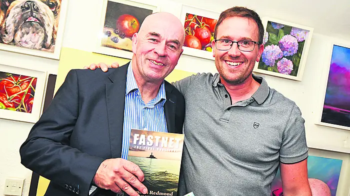 Paul De Waard from Kinsale, who swam from Baltimore to the Fastnet Rock in September, with his swimming hero Steve Redmond at a talk given by Steve in the Owenabue Arts Collective Gallery, during Culture Night in Carrigaline.  (Photo: Siobhán Russell)