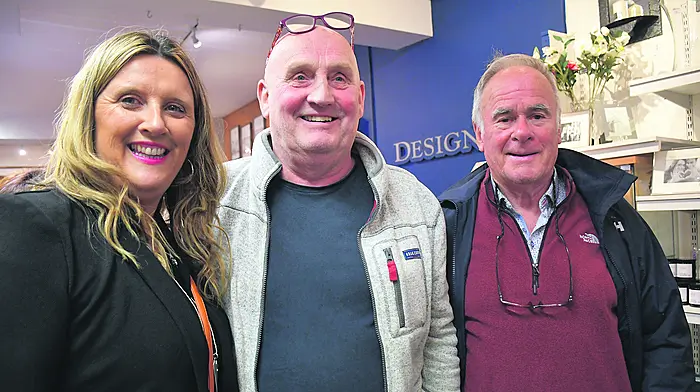 Rita O’Connell, Cian O’Mahony and Eamonn Nealon enjoying the singing and poetry at the Designs shop.