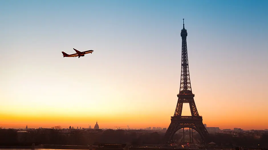 Travel agent offering free return flights to Paris Image