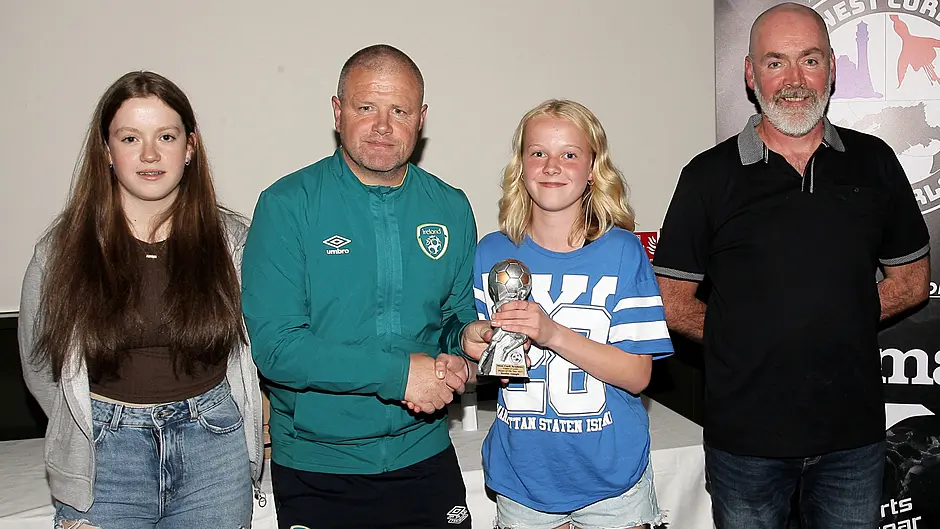 The West Cork Academy's U13 Girls' Players' Player of the ear Keelin Gough (Skibbereen AFC) - with her coaches, Abbie Sheehan and DJ Curtin - is presented with her trophy by John Cotter, FAI Regional High-Performance Coach. (Photo: Paddy Feen)