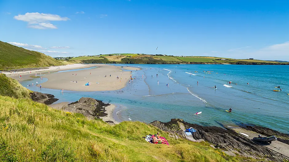Riptide warning for swimmers as four are rescued Image