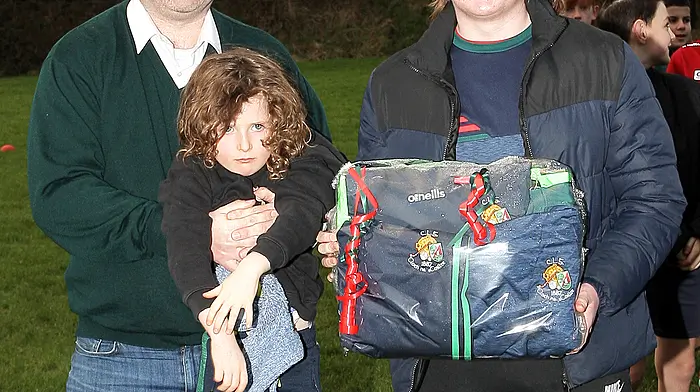 Mark Griffin with his daughter Mia presents the Padraig Griffin Rising Star Award to Ciarán Coakley of Team B.