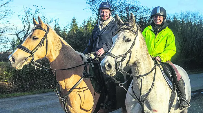 Toby Slocum from Kinsale, riding ‘Echo’ and Katie Flynn from Whites Cross riding ‘Remi’ on a hack near Garrettstown. 					        	         (Photo: Andy Gibson)