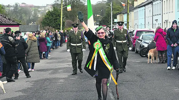 Grand marshal and local lady Teresa Egger waves to the crowd during the Courtmacsherry parade.(Photo: Martin Walsh)
