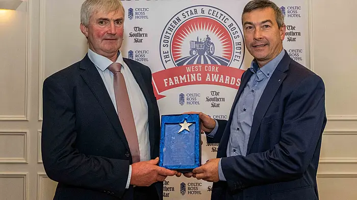 Ronald Shorten collects the August award presented by Stephen Rowe of AIB, Clonakilty.