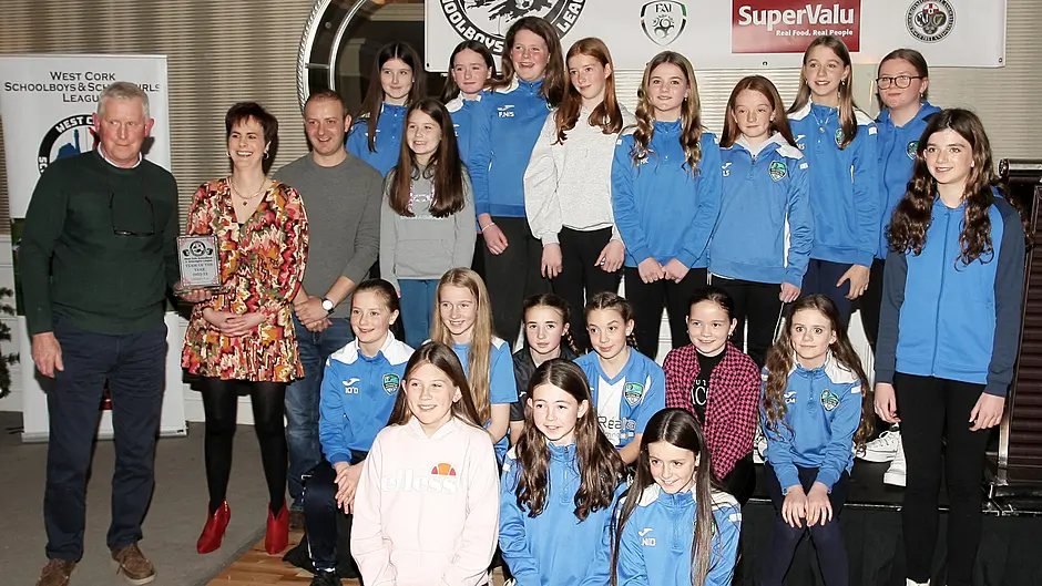 Declan Deasy, chairman of the West Cork Schoolboys and Schoolgirls League, presents the West Cork Schoolboys and Schoolgirls 2023 team of the year trophy to Sullane FC U12 girls' team.(Photo: Paddy Feen)