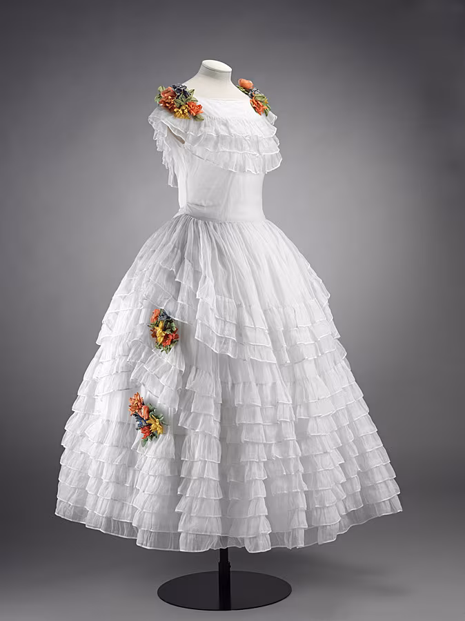 Dress,-'robe-de-style',-white-organza-with-artificial-flowers,--France-©-Victoria-and-Albert-Museum,-London