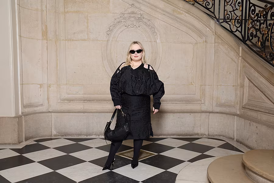 Nicola Coughlan wore a Dior Summer 2025 black silk dress with Dior accessories.
