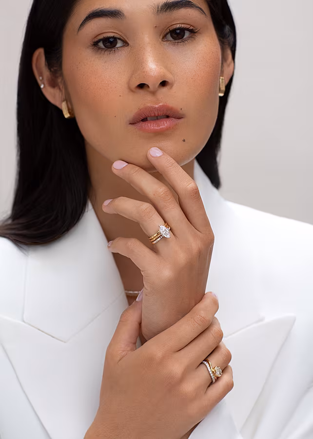 ENGAGEMENT-IMAGE-—-NEWSLETTER.-18ct-1.70ct-Marquise-Cut-Diamond-Ring-€2700.-18ct-Gold-Wedding-Band.-14ct-Ridged-Chunky-Oval-Hoop-Earrings-€575