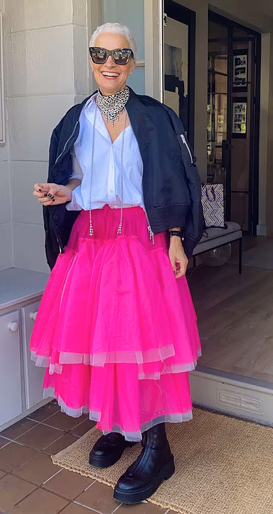 Edel-wearing-pink-skirt-&-the-Row-boots