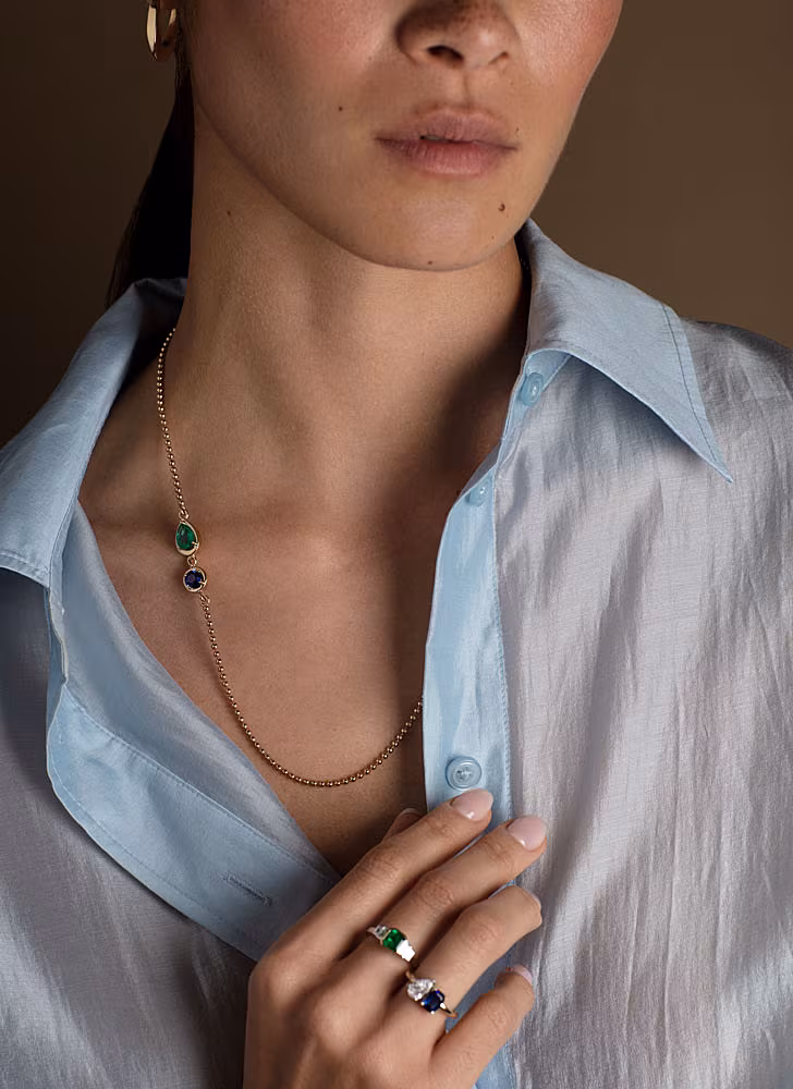 IMAGE-6.-9ct-Emerald-&-Sapphire-Charm-Necklace-€7200.-9ct-Sapphire-&-Diamond-Toi-et-Moi-Ring-€3950.-Platinum-&-18ct-Gold-Emerald-Ring-€5850