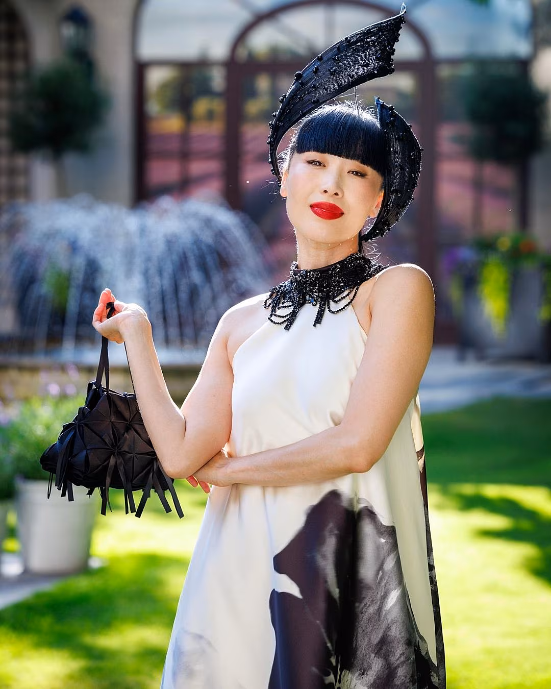 Yomiko Chen wearing Tuam-based Michelle Kearns beaded headpiece and Mikado ecru SIX ROADS dress and Helen Hayes duchess satin bag