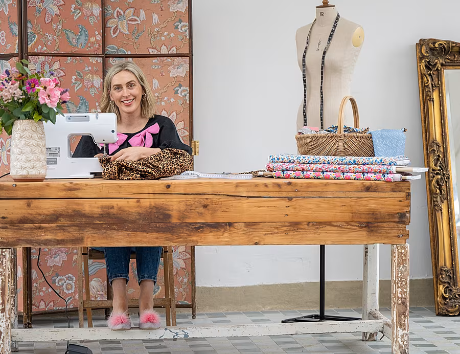 Heidi-Higgins-Sewing-Retreat-Profile-photo-at-sewing-machine