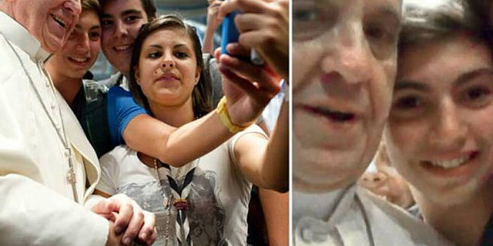 Pope poses for "selfie"...